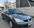 Черный Мицубиси Лансер, объемом двигателя 1.6 л и пробегом 225 тыс. км за 3400 $, фото 6 на Automoto.ua