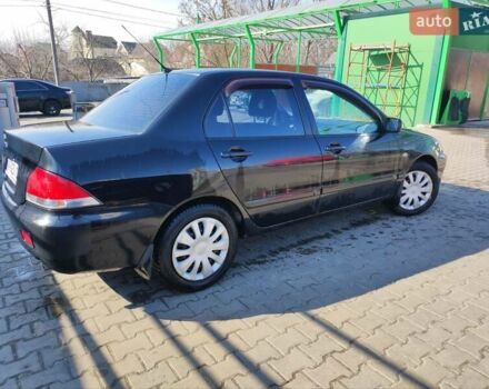 Чорний Міцубісі Lancer, об'ємом двигуна 1.6 л та пробігом 335 тис. км за 3100 $, фото 6 на Automoto.ua