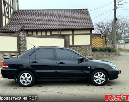 Чорний Міцубісі Lancer, об'ємом двигуна 1.6 л та пробігом 240 тис. км за 4399 $, фото 6 на Automoto.ua