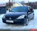 Черный Мицубиси Лансер, объемом двигателя 1.6 л и пробегом 22000 тыс. км за 3950 $, фото 1 на Automoto.ua