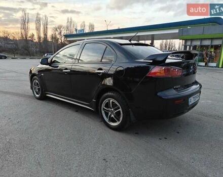 Черный Мицубиси Лансер, объемом двигателя 2 л и пробегом 245 тыс. км за 5600 $, фото 2 на Automoto.ua