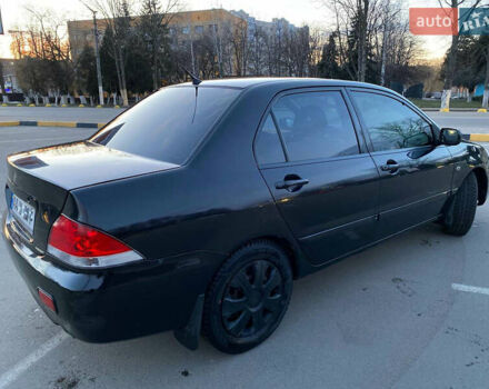 Чорний Міцубісі Lancer, об'ємом двигуна 1.58 л та пробігом 327 тис. км за 4000 $, фото 4 на Automoto.ua