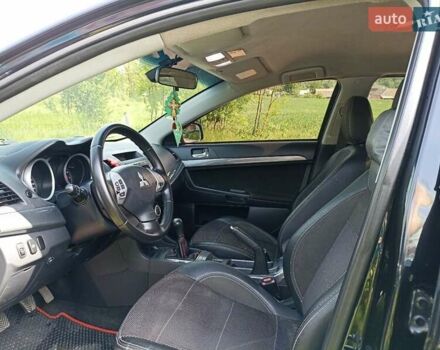 Черный Мицубиси Лансер, объемом двигателя 2 л и пробегом 214 тыс. км за 6300 $, фото 5 на Automoto.ua