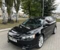 Черный Мицубиси Лансер, объемом двигателя 2 л и пробегом 200 тыс. км за 6800 $, фото 1 на Automoto.ua