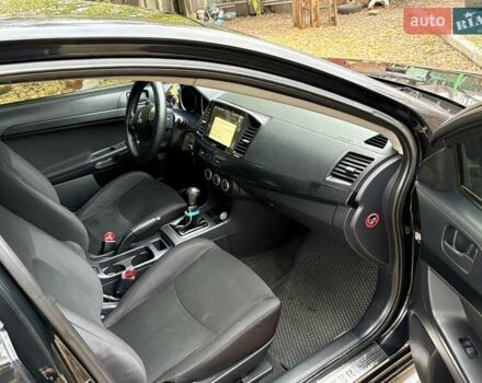 Черный Мицубиси Лансер, объемом двигателя 2 л и пробегом 260 тыс. км за 6100 $, фото 14 на Automoto.ua