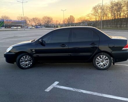 Чорний Міцубісі Lancer, об'ємом двигуна 1.6 л та пробігом 375 тис. км за 4899 $, фото 5 на Automoto.ua