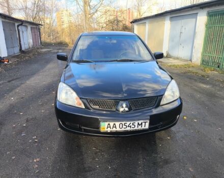 Черный Мицубиси Лансер, объемом двигателя 1.6 л и пробегом 243 тыс. км за 3200 $, фото 1 на Automoto.ua