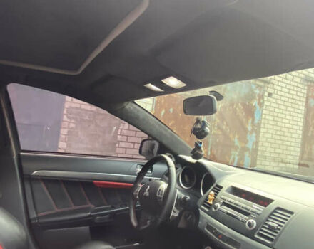 Черный Мицубиси Лансер, объемом двигателя 2 л и пробегом 275 тыс. км за 7700 $, фото 3 на Automoto.ua