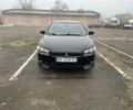 Чорний Міцубісі Lancer, об'ємом двигуна 2 л та пробігом 194 тис. км за 7300 $, фото 1 на Automoto.ua