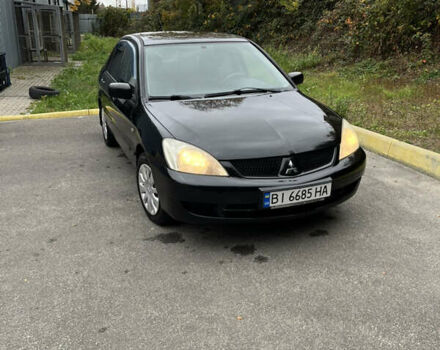 Чорний Міцубісі Lancer, об'ємом двигуна 1.58 л та пробігом 192 тис. км за 4500 $, фото 7 на Automoto.ua