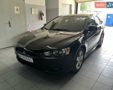 Черный Мицубиси Лансер, объемом двигателя 2 л и пробегом 200 тыс. км за 8000 $, фото 1 на Automoto.ua