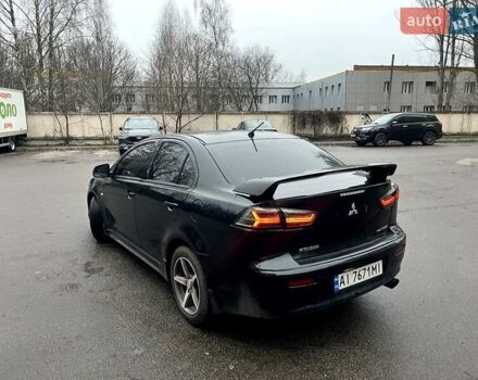 Черный Мицубиси Лансер, объемом двигателя 2 л и пробегом 217 тыс. км за 7000 $, фото 32 на Automoto.ua