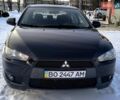 Черный Мицубиси Лансер, объемом двигателя 2 л и пробегом 205 тыс. км за 6500 $, фото 1 на Automoto.ua