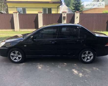 Чорний Міцубісі Lancer, об'ємом двигуна 1.6 л та пробігом 285 тис. км за 5000 $, фото 4 на Automoto.ua