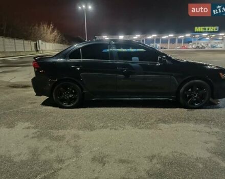 Черный Мицубиси Лансер, объемом двигателя 2 л и пробегом 240 тыс. км за 6400 $, фото 5 на Automoto.ua