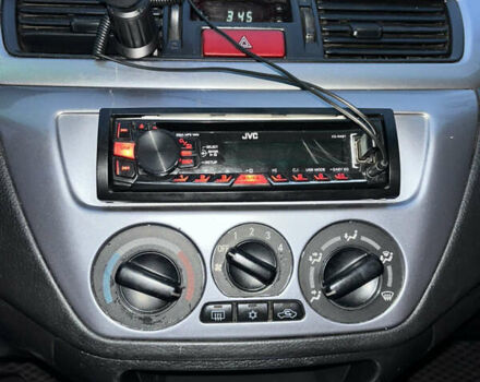 Чорний Міцубісі Lancer, об'ємом двигуна 1.6 л та пробігом 277 тис. км за 3900 $, фото 14 на Automoto.ua