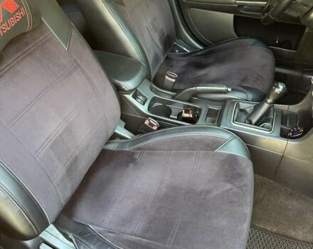 Черный Мицубиси Лансер, объемом двигателя 2 л и пробегом 230 тыс. км за 7000 $, фото 2 на Automoto.ua