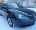 Черный Мицубиси Лансер, объемом двигателя 1.58 л и пробегом 180 тыс. км за 5000 $, фото 1 на Automoto.ua