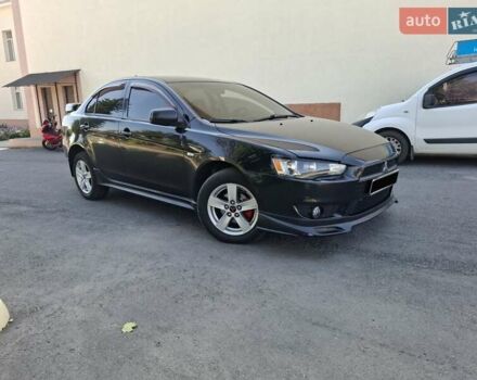 Черный Мицубиси Лансер, объемом двигателя 2 л и пробегом 230 тыс. км за 7000 $, фото 27 на Automoto.ua