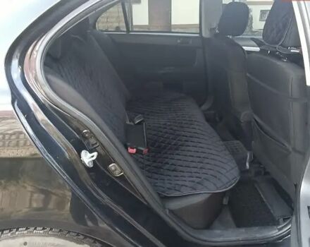 Черный Мицубиси Лансер, объемом двигателя 2 л и пробегом 210 тыс. км за 6250 $, фото 10 на Automoto.ua