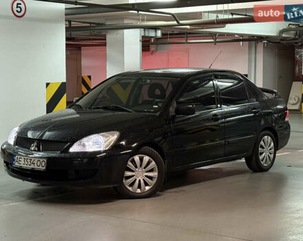 Чорний Міцубісі Lancer, об'ємом двигуна 1.58 л та пробігом 212 тис. км за 5500 $, фото 1 на Automoto.ua