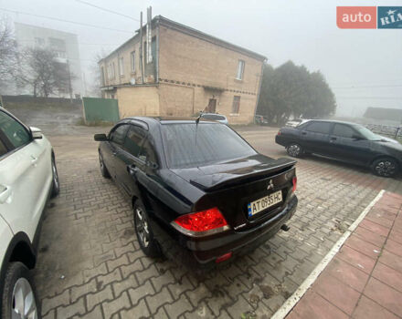 Черный Мицубиси Лансер, объемом двигателя 1.58 л и пробегом 211 тыс. км за 6333 $, фото 20 на Automoto.ua