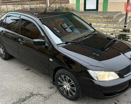 Чорний Міцубісі Lancer, об'ємом двигуна 1.58 л та пробігом 167 тис. км за 4800 $, фото 5 на Automoto.ua