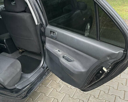 Черный Мицубиси Лансер, объемом двигателя 1.58 л и пробегом 214 тыс. км за 4400 $, фото 16 на Automoto.ua