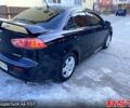 Чорний Міцубісі Lancer, об'ємом двигуна 2 л та пробігом 200 тис. км за 7500 $, фото 4 на Automoto.ua