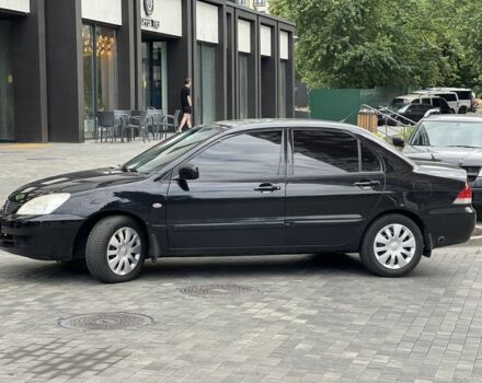 Черный Мицубиси Лансер, объемом двигателя 1.6 л и пробегом 168 тыс. км за 5662 $, фото 4 на Automoto.ua