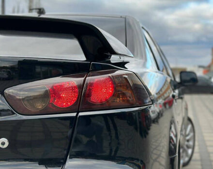 Черный Мицубиси Лансер, объемом двигателя 2 л и пробегом 236 тыс. км за 7950 $, фото 1 на Automoto.ua