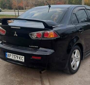 Черный Мицубиси Лансер, объемом двигателя 2 л и пробегом 211 тыс. км за 6900 $, фото 6 на Automoto.ua