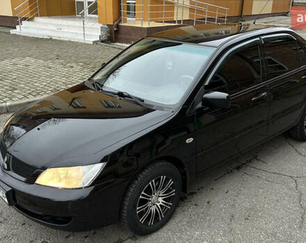 Чорний Міцубісі Lancer, об'ємом двигуна 1.58 л та пробігом 167 тис. км за 4800 $, фото 7 на Automoto.ua