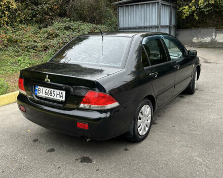 Чорний Міцубісі Lancer, об'ємом двигуна 1.58 л та пробігом 192 тис. км за 4500 $, фото 2 на Automoto.ua