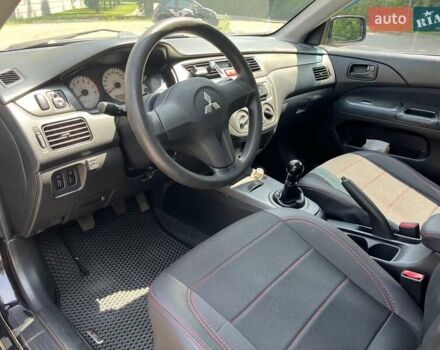 Чорний Міцубісі Lancer, об'ємом двигуна 1.6 л та пробігом 296 тис. км за 4200 $, фото 32 на Automoto.ua