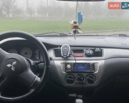 Черный Мицубиси Лансер, объемом двигателя 1.58 л и пробегом 211 тыс. км за 6333 $, фото 30 на Automoto.ua