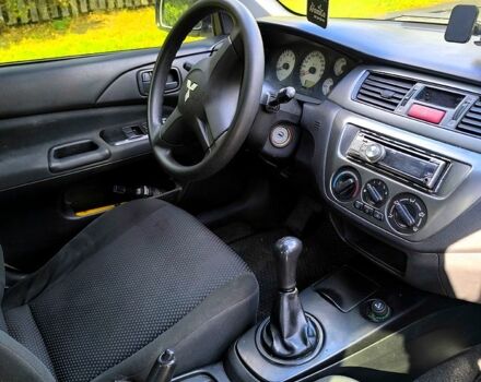 Черный Мицубиси Лансер, объемом двигателя 1.6 л и пробегом 232 тыс. км за 4400 $, фото 4 на Automoto.ua