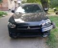 Черный Мицубиси Лансер, объемом двигателя 2 л и пробегом 180 тыс. км за 5800 $, фото 1 на Automoto.ua