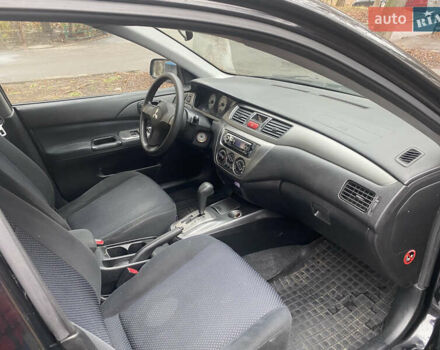 Черный Мицубиси Лансер, объемом двигателя 1.6 л и пробегом 143 тыс. км за 3000 $, фото 6 на Automoto.ua