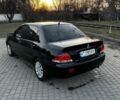 Черный Мицубиси Лансер, объемом двигателя 1.6 л и пробегом 250 тыс. км за 3500 $, фото 1 на Automoto.ua