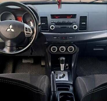 Черный Мицубиси Лансер, объемом двигателя 2 л и пробегом 211 тыс. км за 6900 $, фото 9 на Automoto.ua