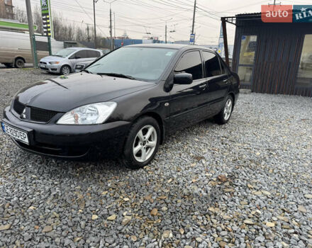 Черный Мицубиси Лансер, объемом двигателя 1.58 л и пробегом 202 тыс. км за 4100 $, фото 1 на Automoto.ua