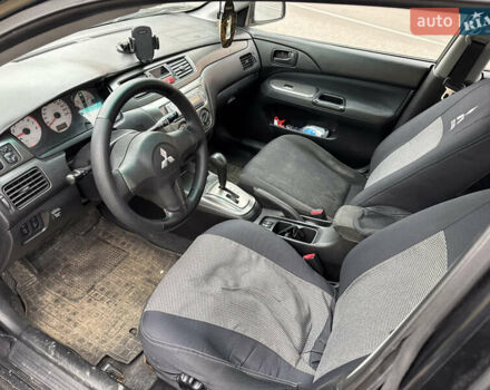 Чорний Міцубісі Lancer, об'ємом двигуна 1.58 л та пробігом 388 тис. км за 2300 $, фото 8 на Automoto.ua
