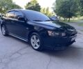 Чорний Міцубісі Lancer, об'ємом двигуна 2 л та пробігом 215 тис. км за 7700 $, фото 1 на Automoto.ua