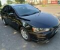 Чорний Міцубісі Lancer, об'ємом двигуна 2 л та пробігом 147 тис. км за 7800 $, фото 1 на Automoto.ua