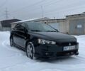 Черный Мицубиси Лансер, объемом двигателя 2 л и пробегом 247 тыс. км за 4900 $, фото 1 на Automoto.ua