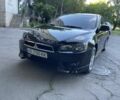 Чорний Міцубісі Lancer, об'ємом двигуна 2 л та пробігом 215 тис. км за 7700 $, фото 1 на Automoto.ua