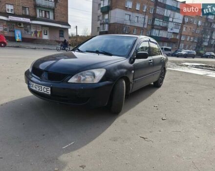 Черный Мицубиси Лансер, объемом двигателя 1.6 л и пробегом 358 тыс. км за 4300 $, фото 1 на Automoto.ua