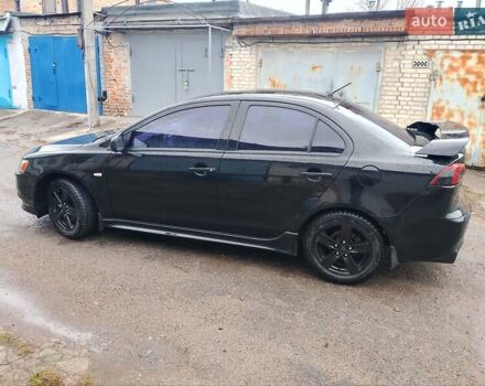 Чорний Міцубісі Lancer, об'ємом двигуна 2 л та пробігом 210 тис. км за 7100 $, фото 1 на Automoto.ua