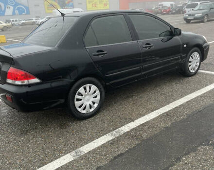 Черный Мицубиси Лансер, объемом двигателя 1.58 л и пробегом 214 тыс. км за 4400 $, фото 2 на Automoto.ua